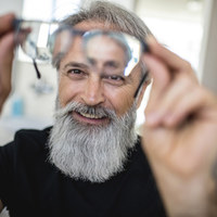 Mature man testing out new glasses
