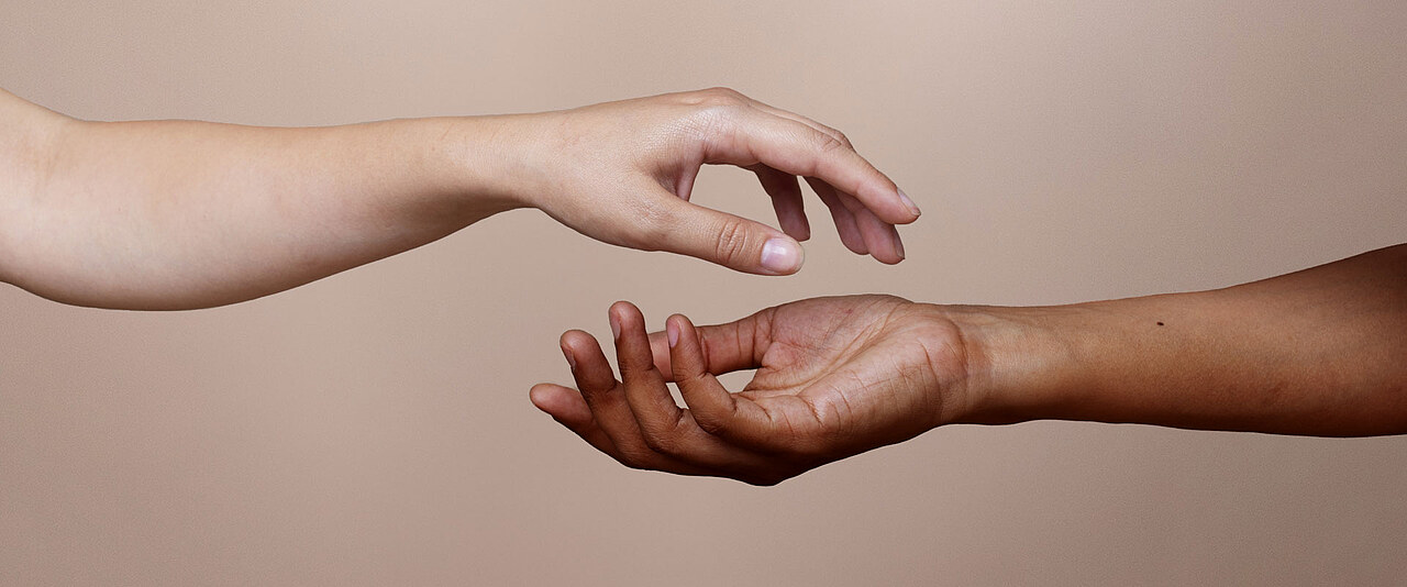 hands reaching each other