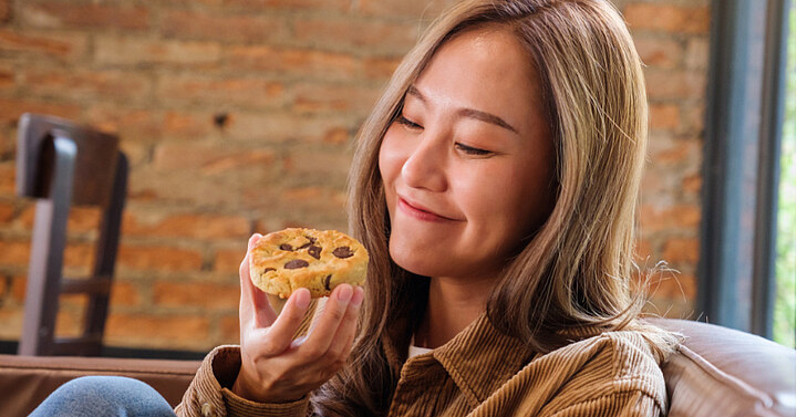 Woman eating a cookie