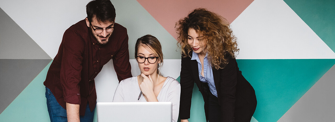 Code of Conduct People gathered over a laptop