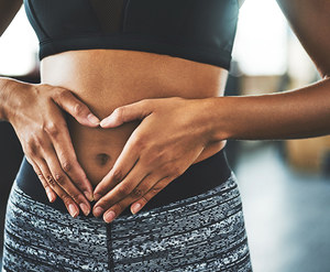 Woman's hands on her stomach
