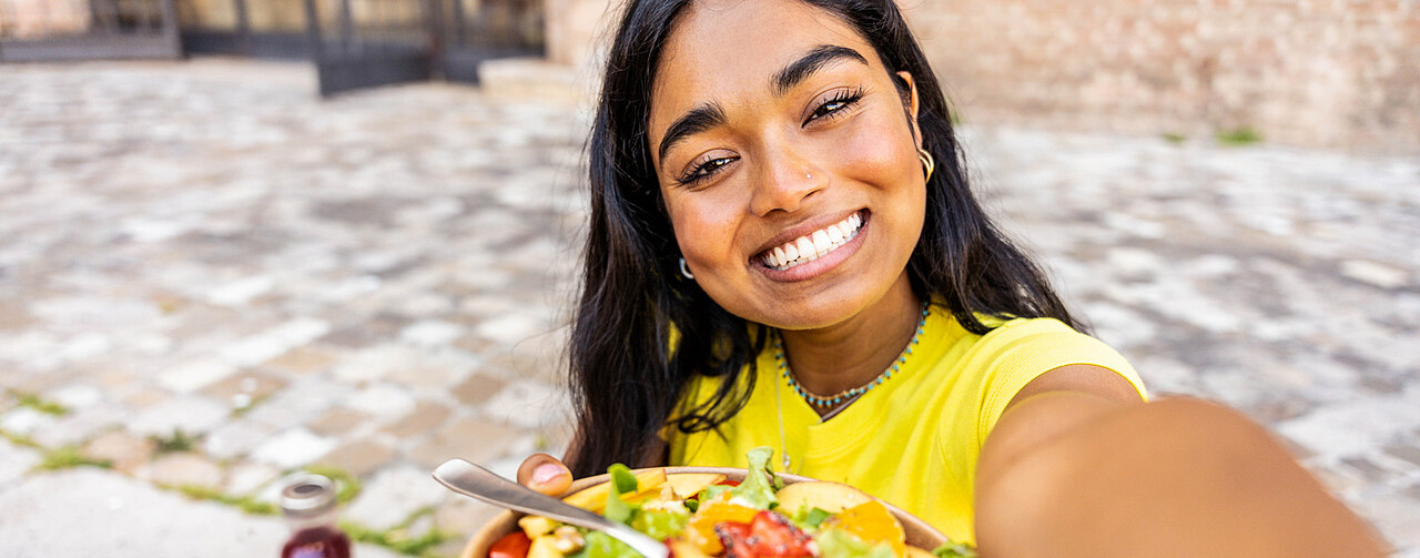 Woman with a salad outdoors