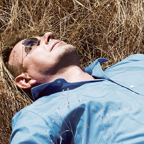 Man lying in field