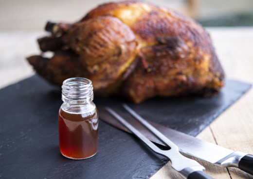 Roasted chicken and a bottle of broth