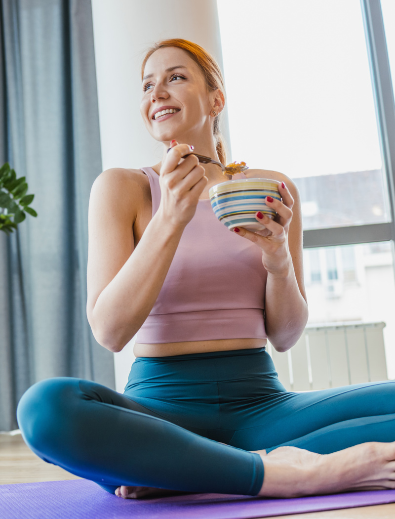 Woman eating a healthy snack after exercising